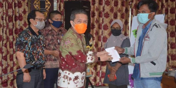 Bupati Syahirsah Ajak Warga Selalu Gunakan Masker