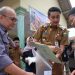 PJ Bupati Muaro Jambi Serahkan Sertifikat Redistribusi Tanah di Desa Talang Belido